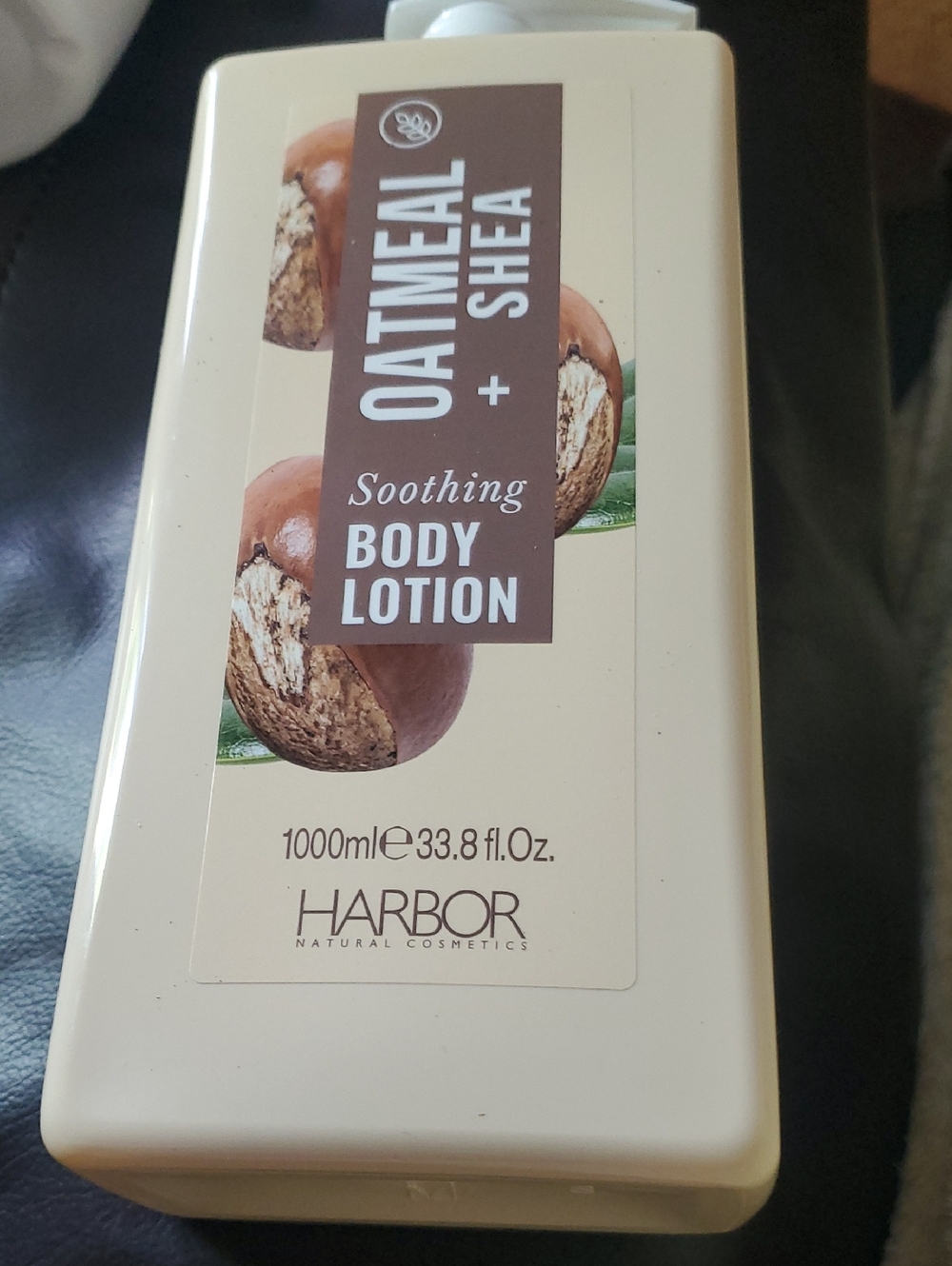Arbor Oatmeal & Shea Body Lotion in cream and brown